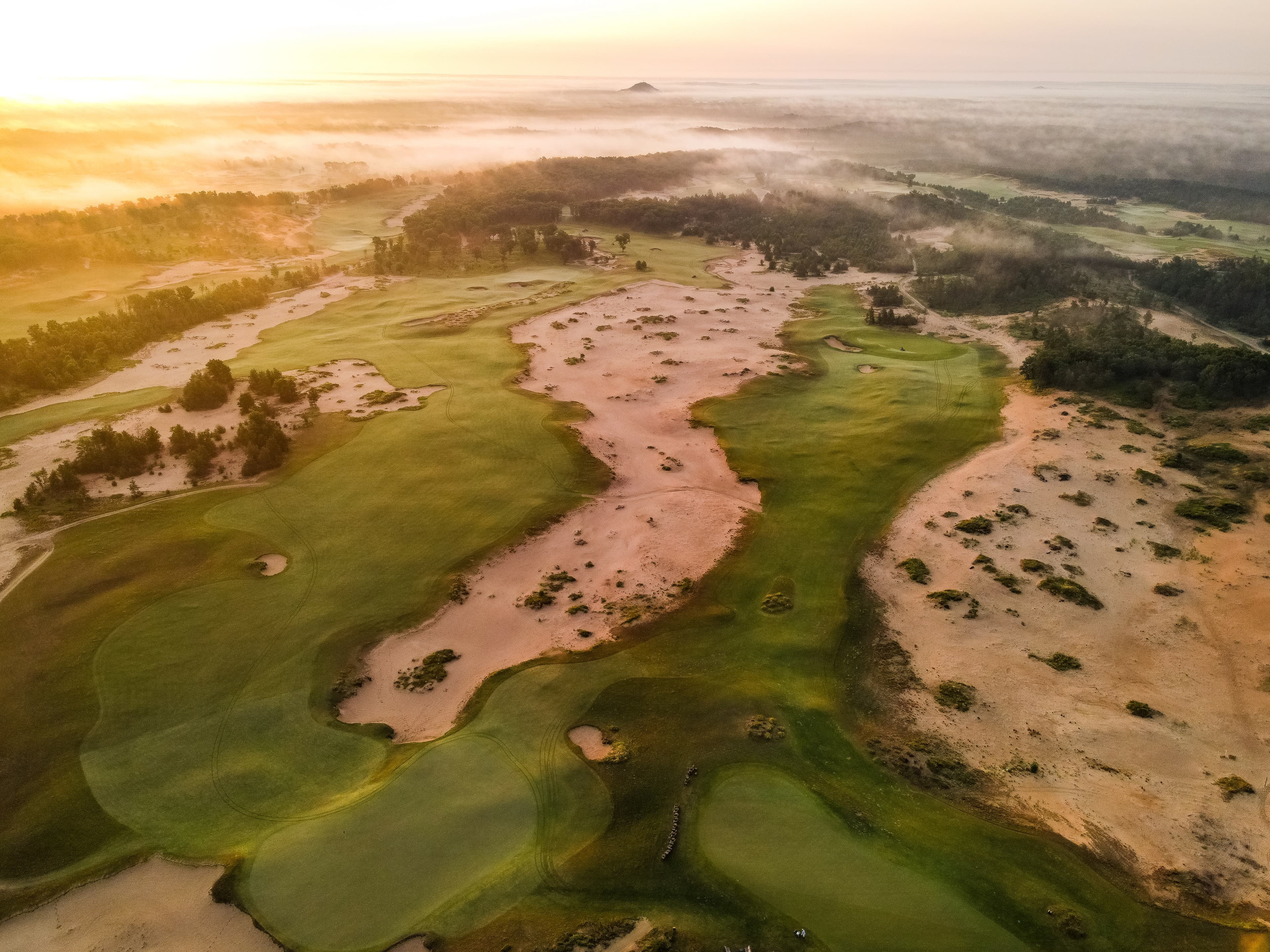 Mammoth Dunes golf course at Sand Valley showing wide fairways and towering sand dunes