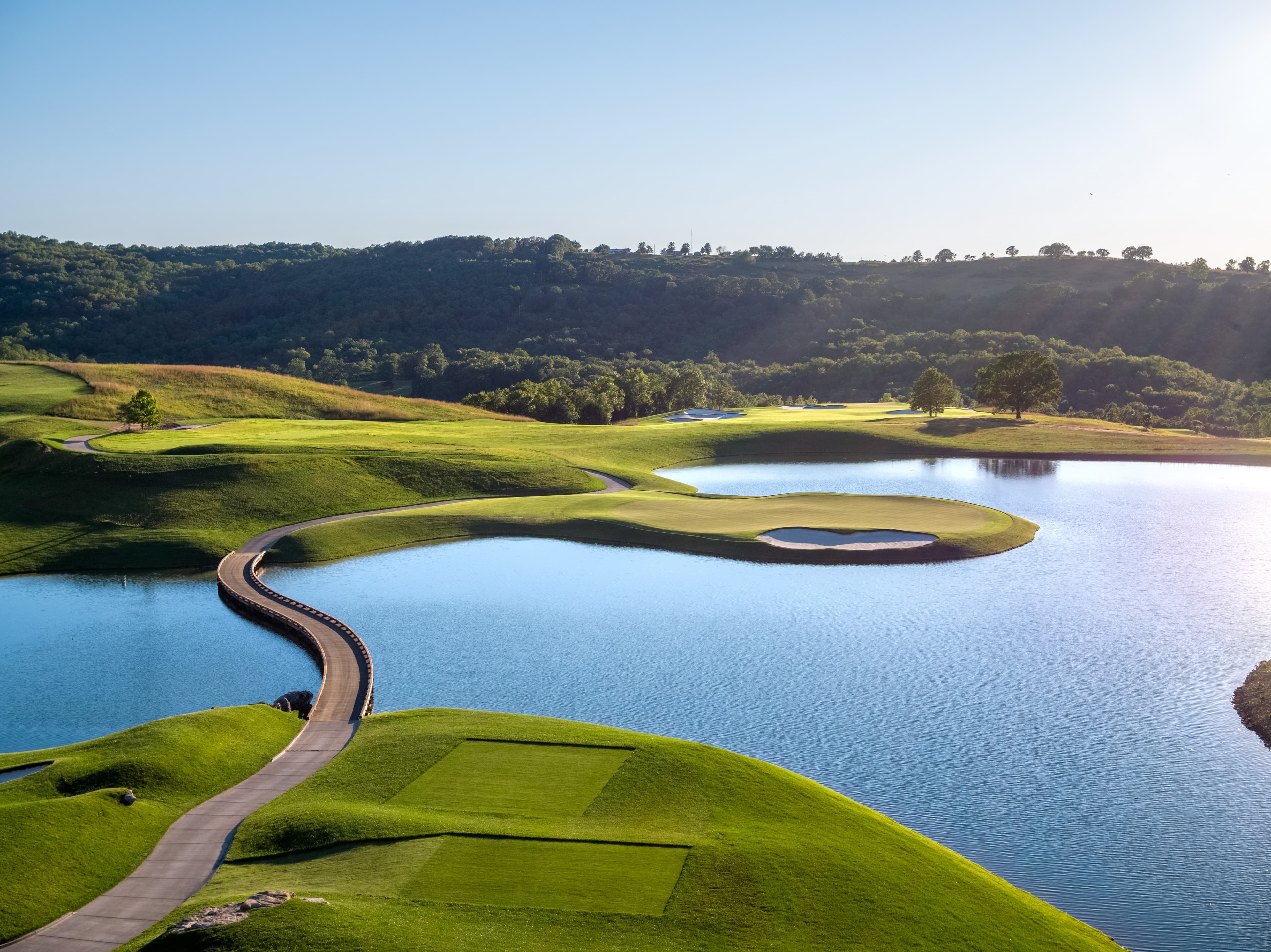 Aerial view of Payne's Valley Golf Course showing the signature hole with winding path across the lake to the green