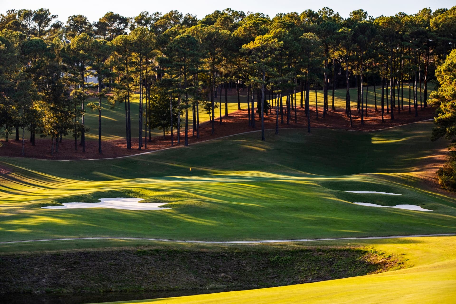 Aerial view of the Ross Bridge course on the Robert Trent Jones Golf Trail in Hoover, Alabama, fairways and water below the resort clubhouse.