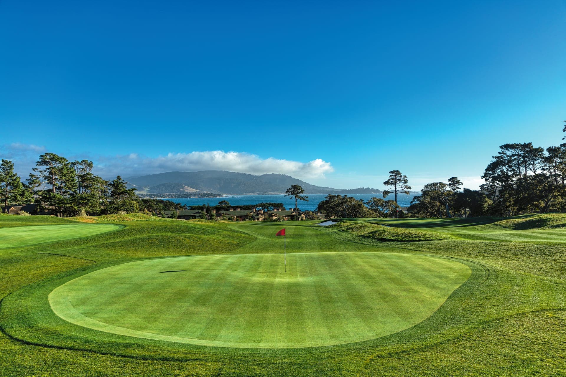 Dusk light over the 9th green at The Hay Short Course with the Santa Lucia mountains across Carmel Bay
