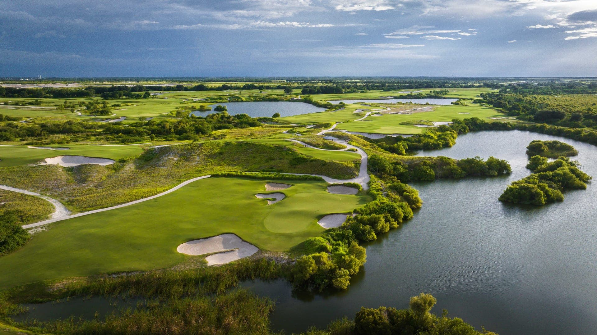 High aerial of Streamsong Blue showing lakes, sand contours and routing across reclaimed phosphate mining terrain, designed by Tom Doak