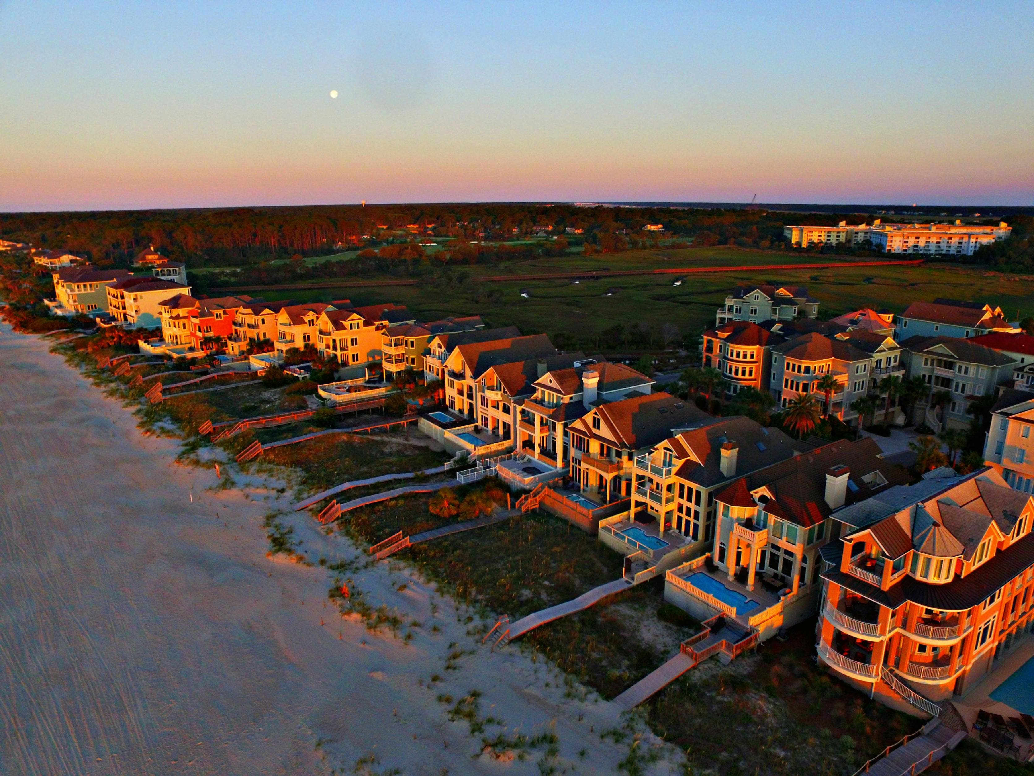 Aerial view of beachfront homes on Hilton Head Island at sunset with moonrise